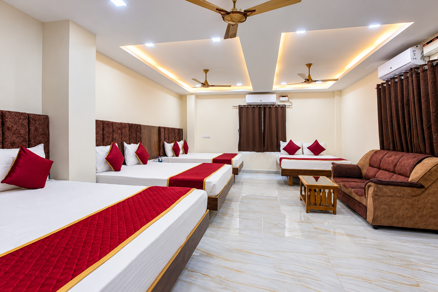 Spacious red and gold hotel room