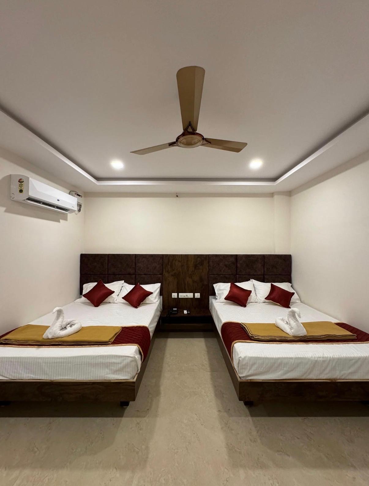 Room with beds and wooden headboard
